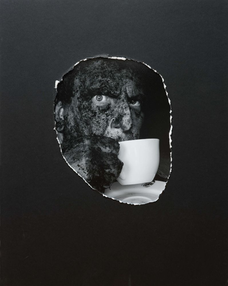 I liked the contrast of the dirty face and the pristine cup, but the camera competition judge didn't